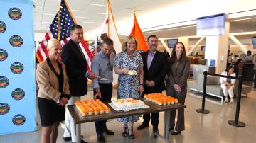 County officials cutting cake