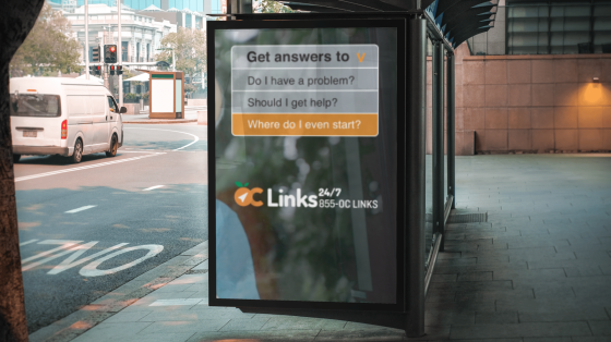 Bus stop advertisement display, displaying information about OC Links, a mental health resource