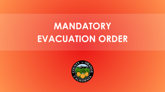 The image contains a bold warning message that reads "MANDATORY EVACUATION ORDER" in white capital letters against a gradient red-orange background. Below the text, there is the official seal of Orange County, California.