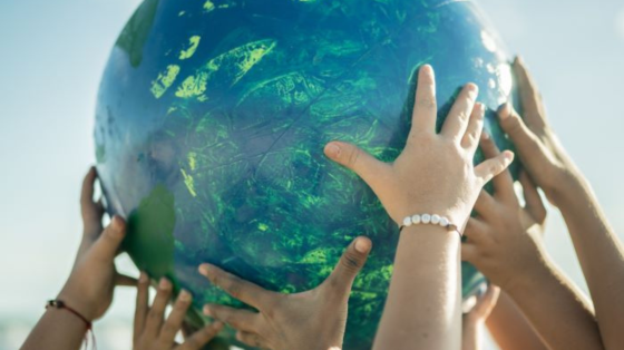 hands holding up a globe