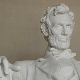 a statue of abraham lincoln in the lincoln memorial in washington, dc