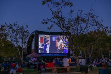 Moviegoers enjoy a showing of The School of Rock at Irvine Regional Park in Orange in 2022.