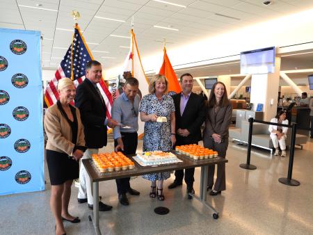 County officials cutting cake