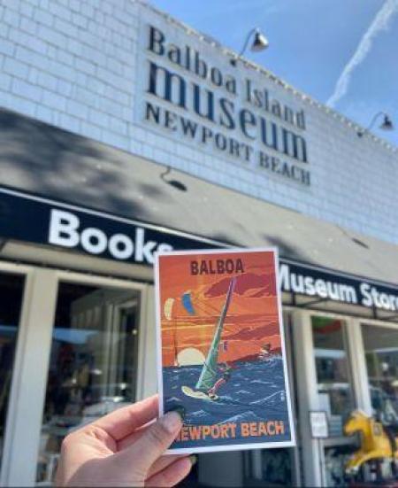 Balboa Postcard held in front of Balboa Island Museum Building, courtesy of Balboa Island Museum website.