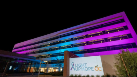 a building lit up with purple and blue lights