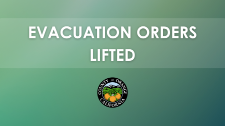 contains a message stating "EVACUATION ORDERS LIFTED" with the seal of Orange County, California, at the bottom. The background is a gradient of green shades.